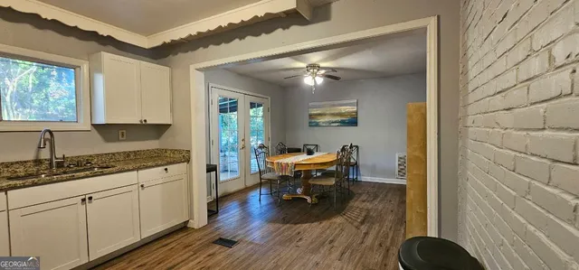 a bathroom with a mirror and a sink