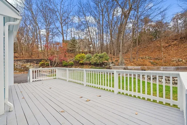 a view of a balcony with wooden floor