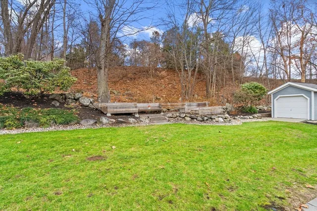 a backyard of a house with lots of green space