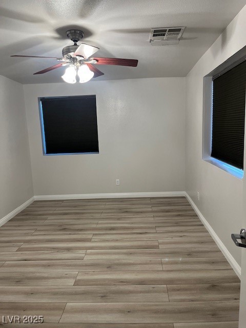 1602 Foothill Drive Boulder City, NV 89005 - Photo 14 of 25 Empty room with light wood-type flooring and ceiling fan