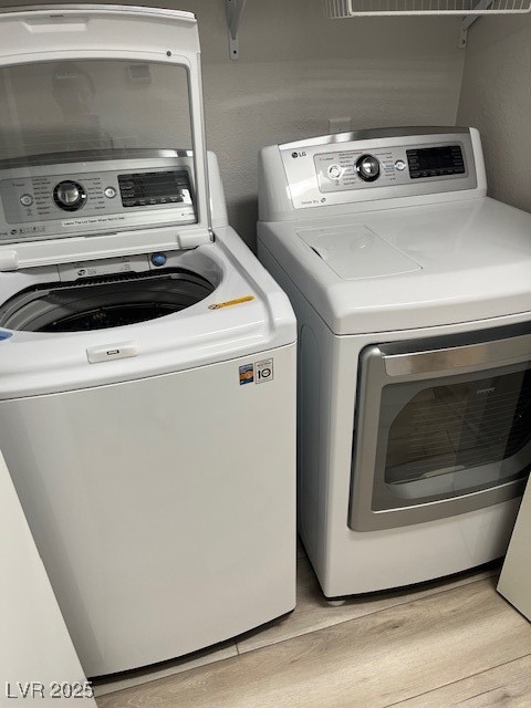 1602 Foothill Drive Boulder City, NV 89005 - Photo 21 of 25 Washroom with light wood-type flooring and washer and clothes dryer