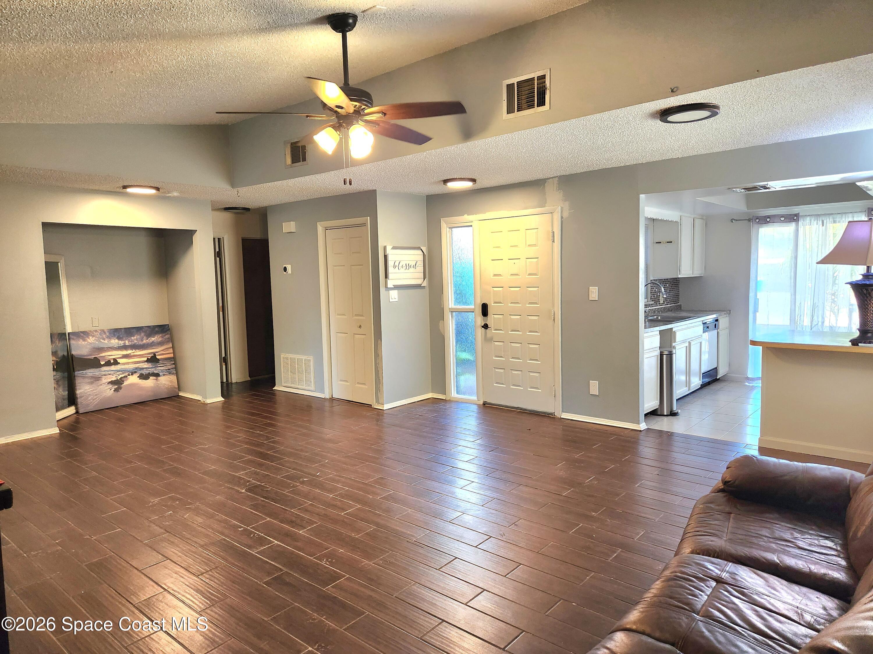 a view of a livingroom with furniture and wooden floor