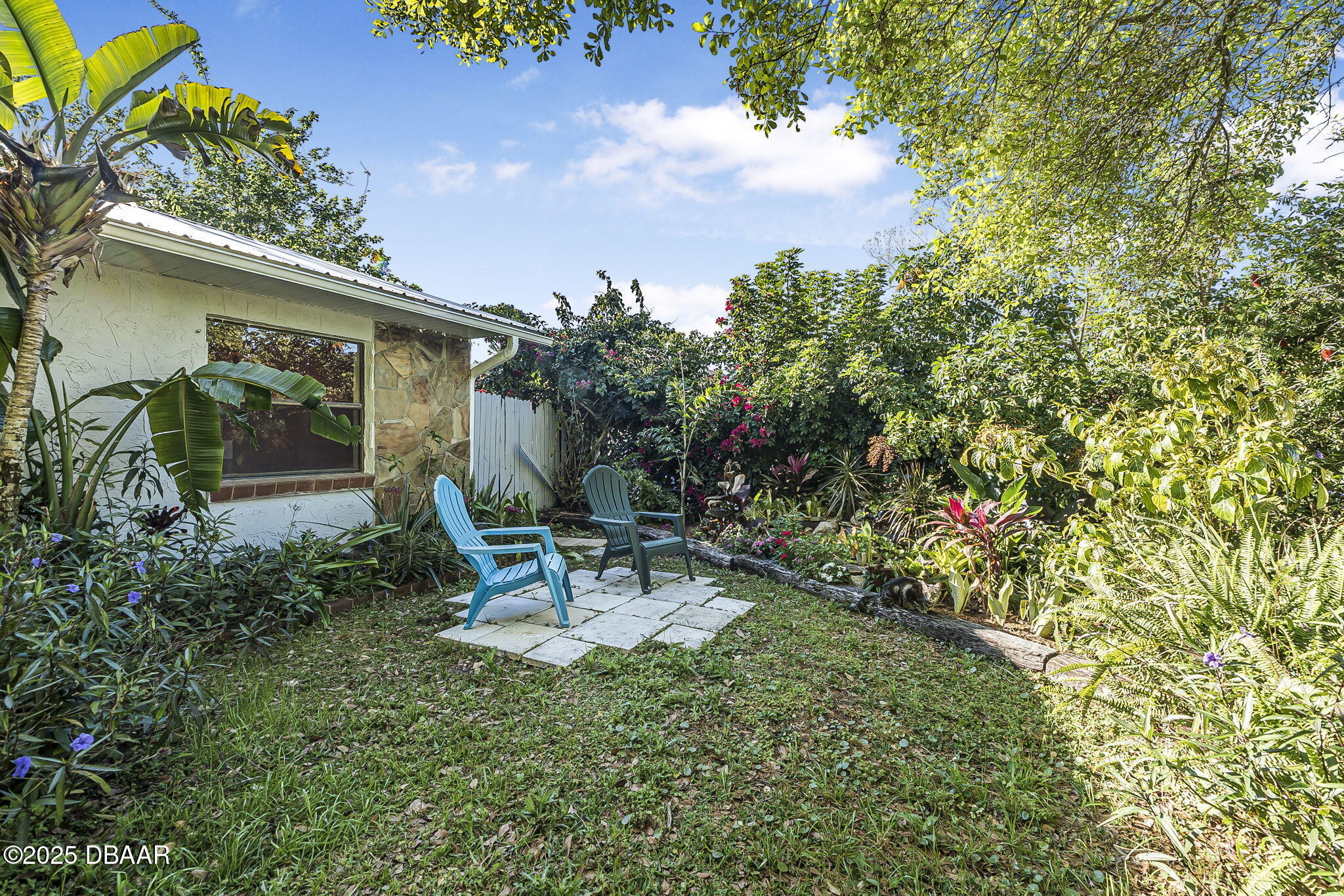 3228 Unity Tree Drive Edgewater, FL 32141 - Photo 29 of 37 a backyard of a house with table and chairs