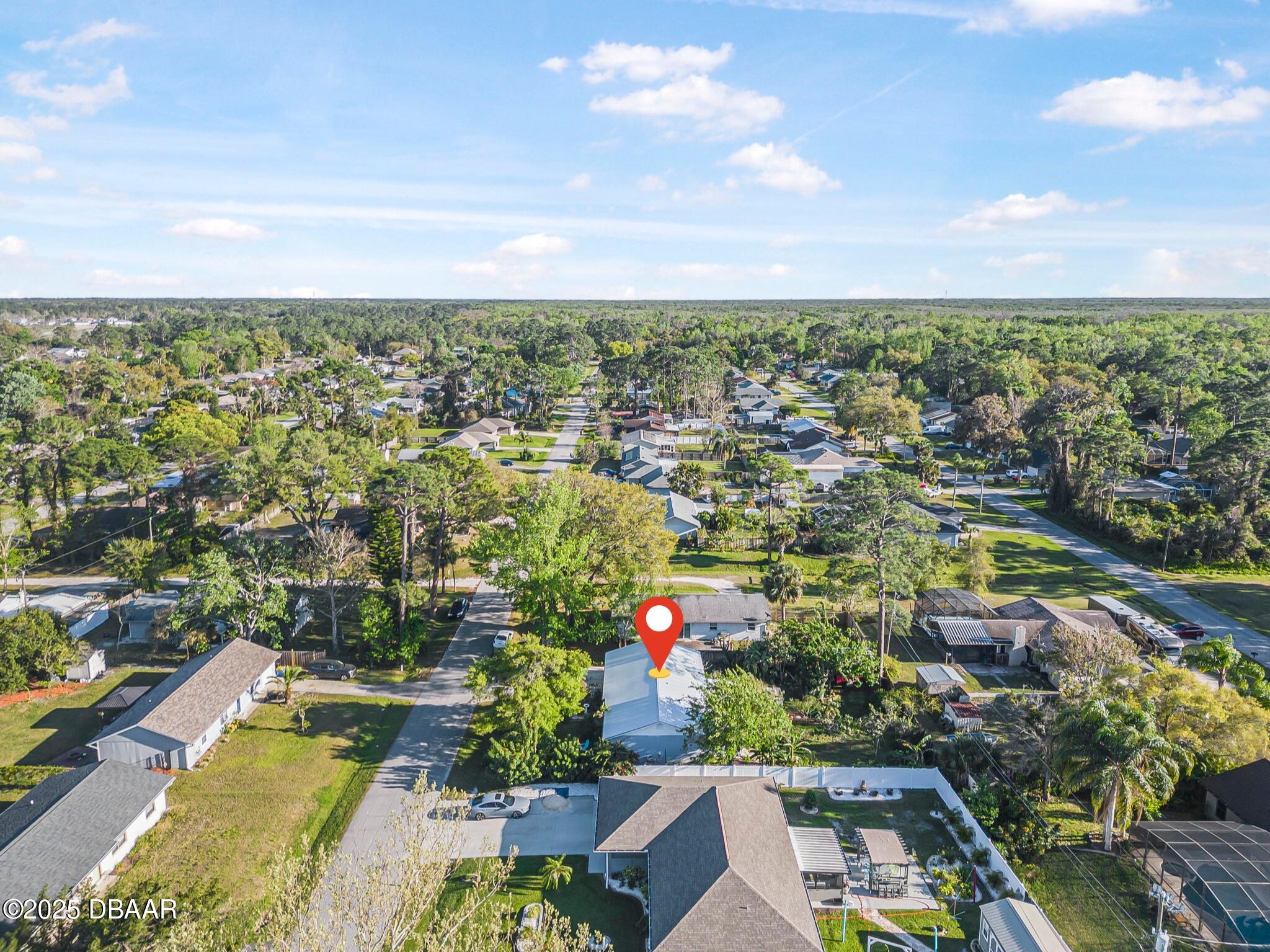 3228 Unity Tree Drive Edgewater, FL 32141 - Photo 35 of 37 an aerial view of residential house and lake