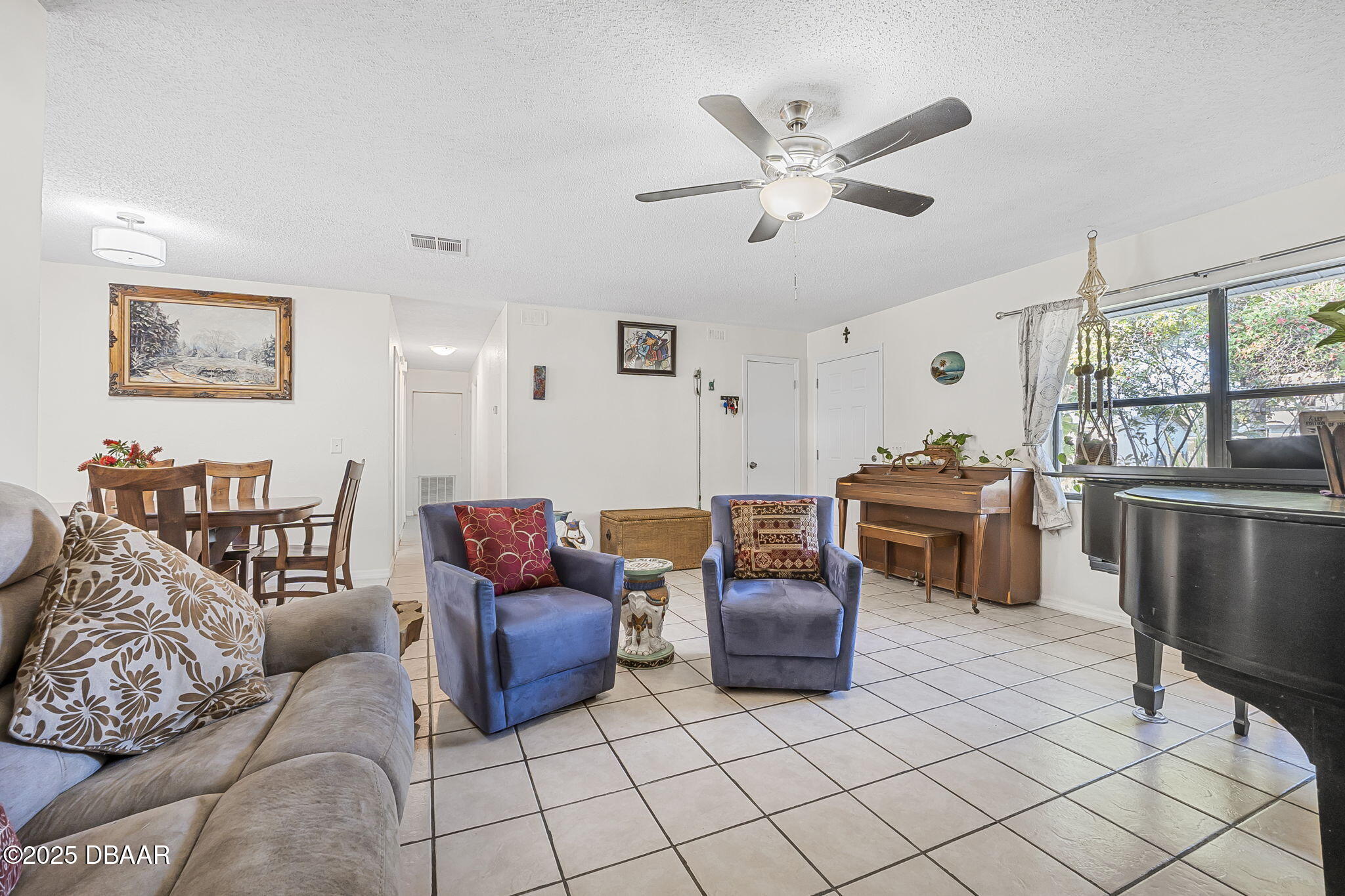3228 Unity Tree Drive Edgewater, FL 32141 - Photo 7 of 37 a living room with furniture and kitchen view