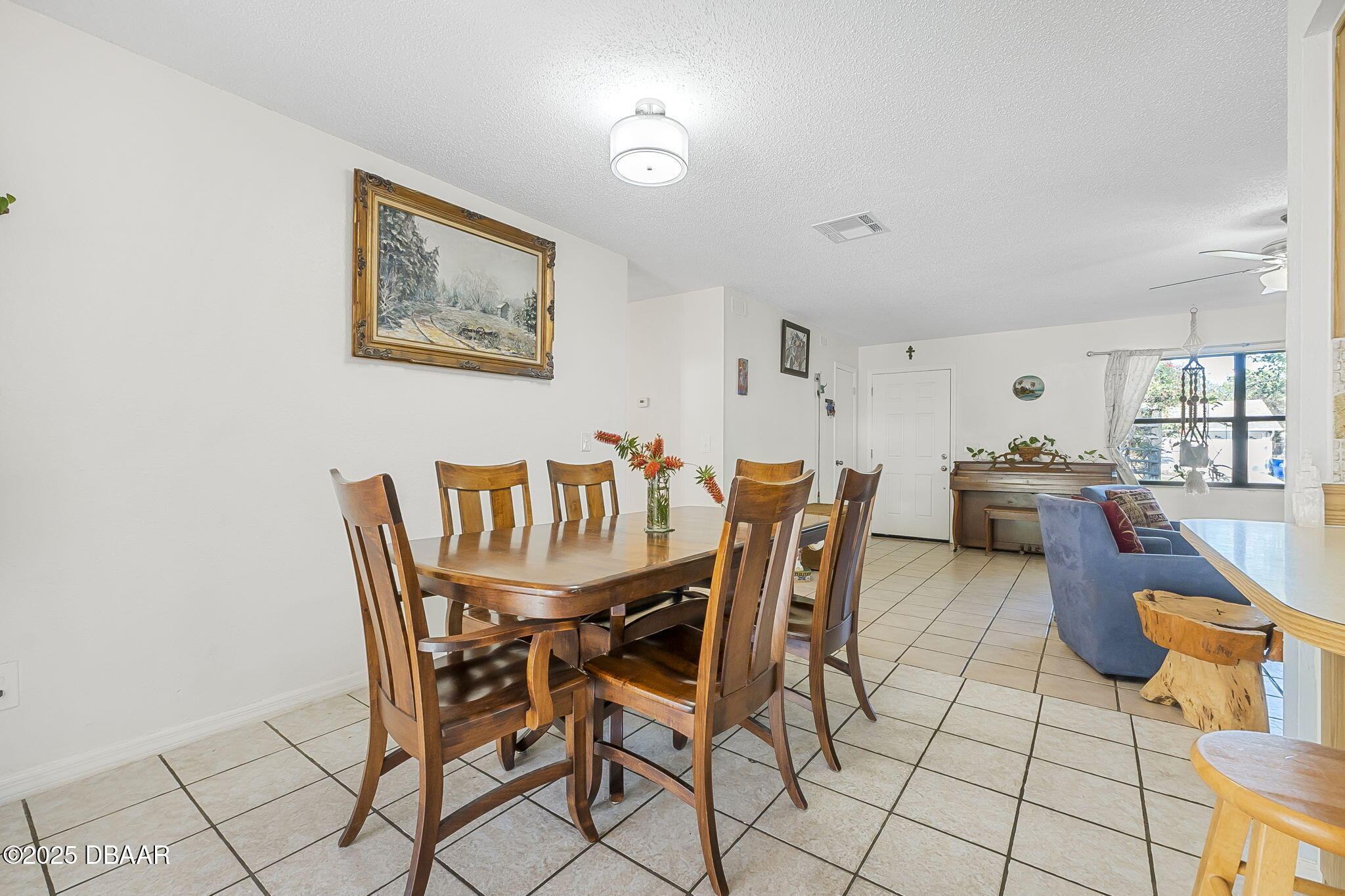 3228 Unity Tree Drive Edgewater, FL 32141 - Photo 8 of 37 a dining room with furniture and window