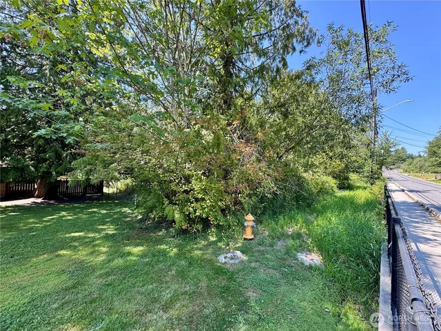 a backyard of a house with lots of green space