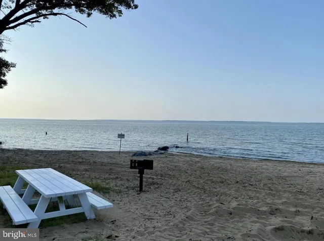 a living room with fireplace furniture and a window