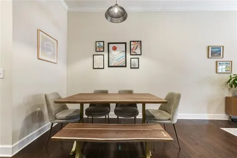 a view of a dining room with furniture and wooden floor