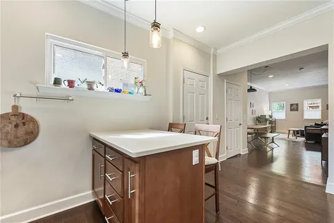 a view of a dining table chairs and chandelier