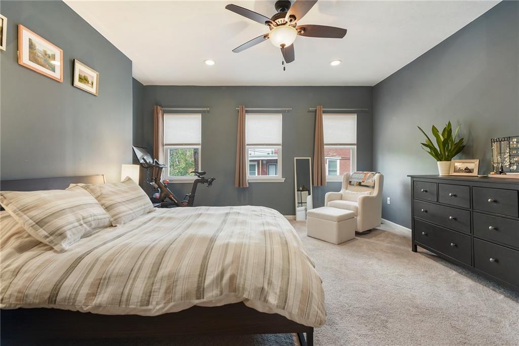 113 42nd Street Pittsburgh, PA 15201 - Photo 21 of 39 a bedroom with a bed and wooden floor