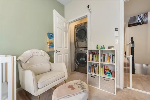 a living room with furniture workspace and a book shelf
