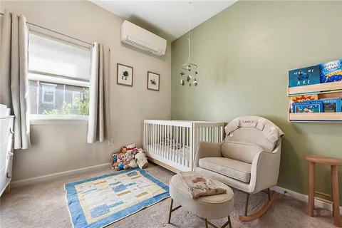 a bedroom with furniture and a window