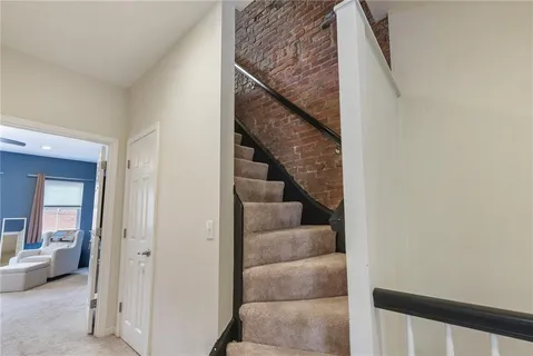a view of entryway and hall with a couch