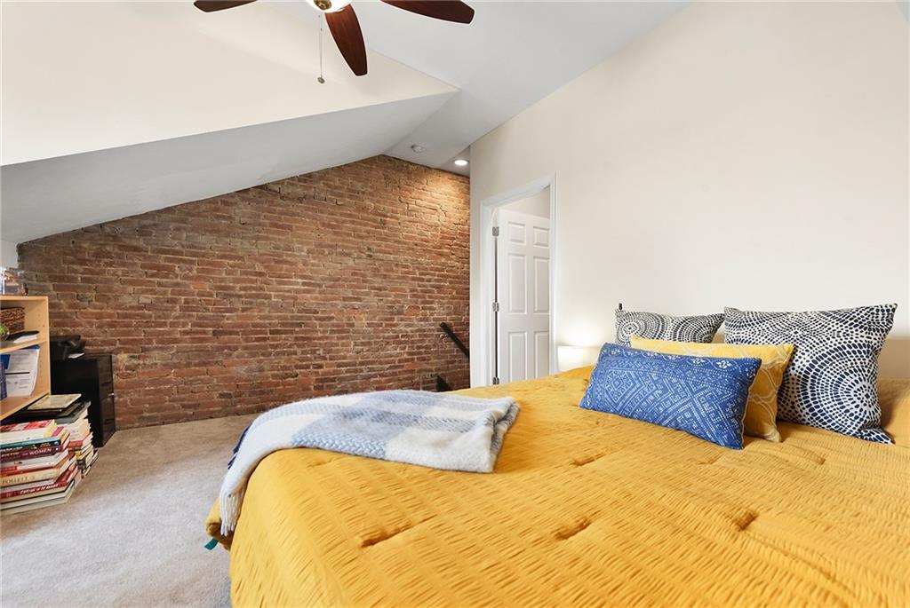 113 42nd Street Pittsburgh, PA 15201 - Photo 32 of 39 a bedroom with a bed and a night stand