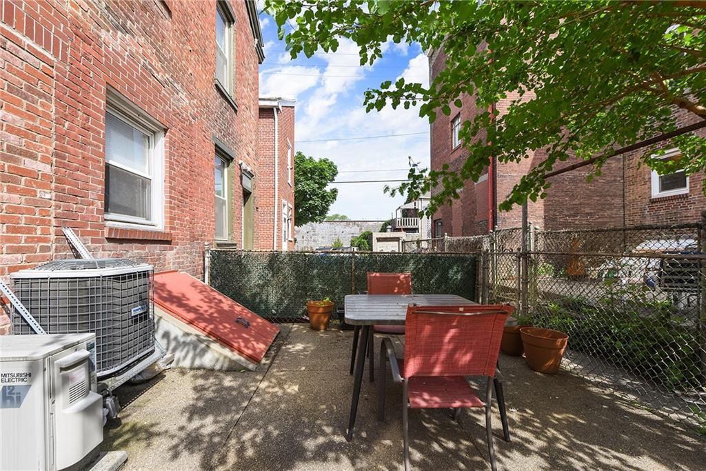113 42nd Street Pittsburgh, PA 15201 - Photo 37 of 39 a view of a patio with table and chairs and potted plants