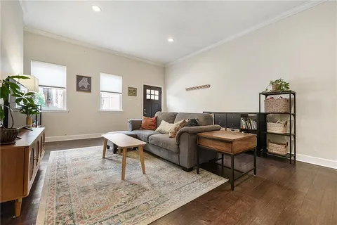 a living room with furniture and a rug