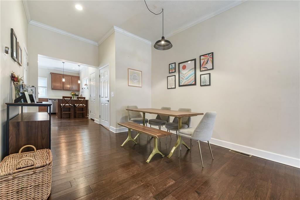 113 42nd Street Pittsburgh, PA 15201 - Photo 10 of 39 a dining room with wooden floor and chandelier