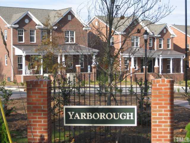 1532 Yarborough Park Drive Raleigh, NC 27604 - Photo 1 of 10 a view of a brick building with large windows