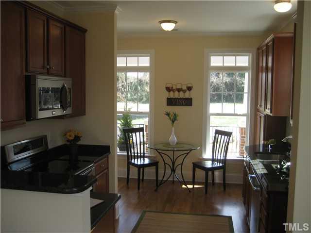 1532 Yarborough Park Drive Raleigh, NC 27604 - Photo 4 of 10 a kitchen with a table chairs and a window