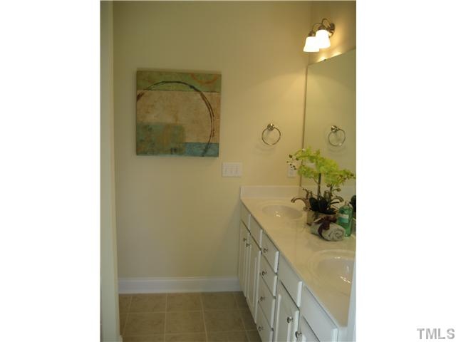 1532 Yarborough Park Drive Raleigh, NC 27604 - Photo 8 of 10 a bathroom with a sink and mirror
