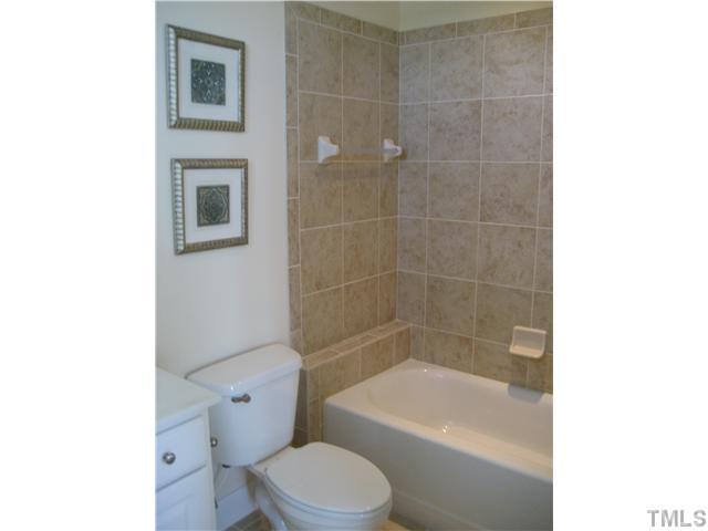 1532 Yarborough Park Drive Raleigh, NC 27604 - Photo 9 of 10 a bath room with a toilet a bath tub and a shower