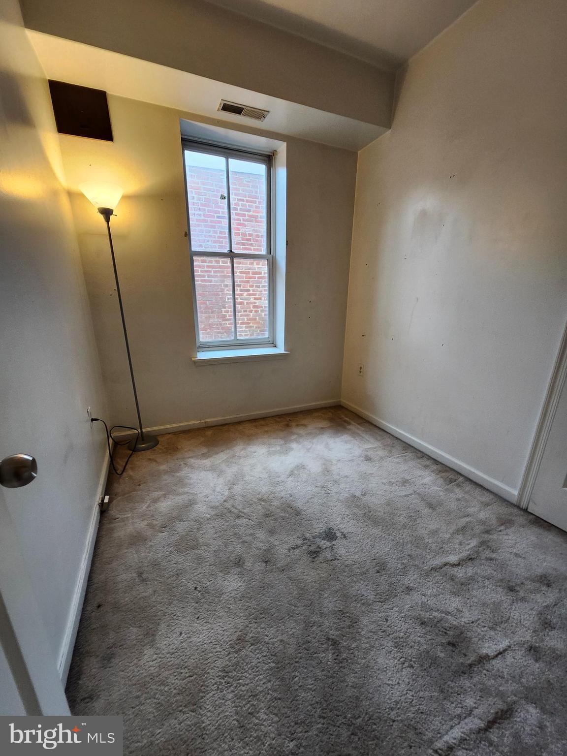 512 U Street Northwest, Unit 8 Washington, DC 20001 - Photo 4 of 9 an empty room with windows