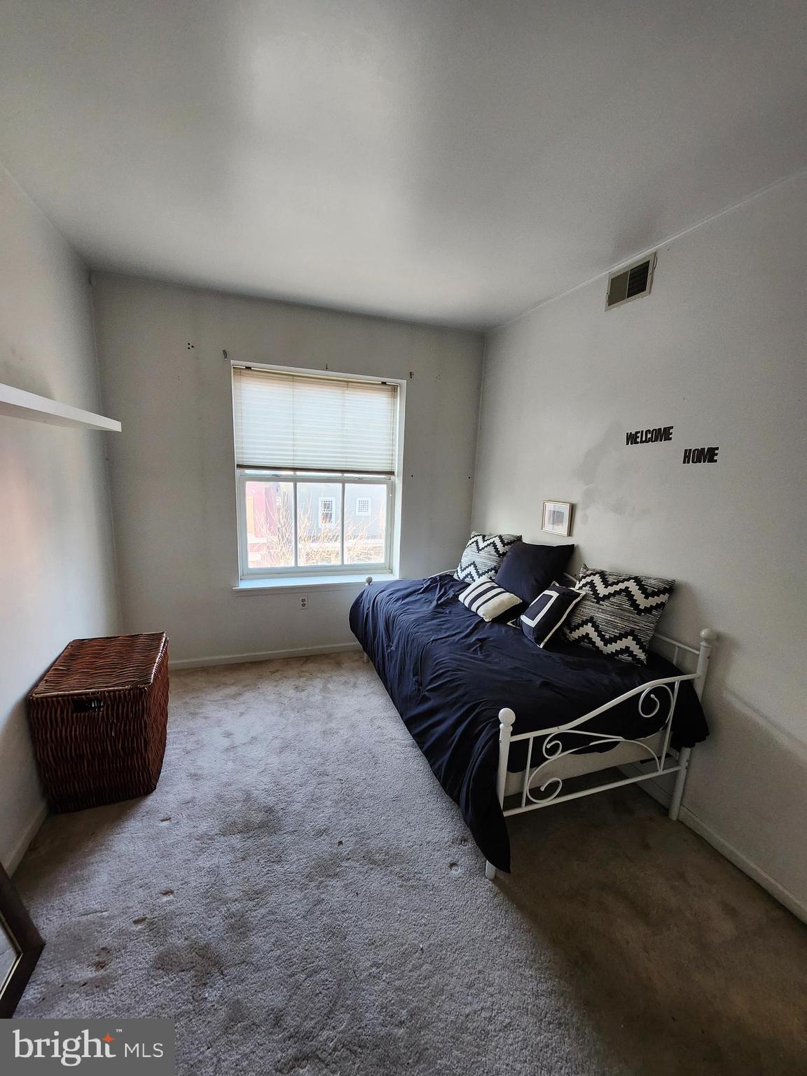512 U Street Northwest, Unit 8 Washington, DC 20001 - Photo 9 of 9 a bed room with a bed and a window