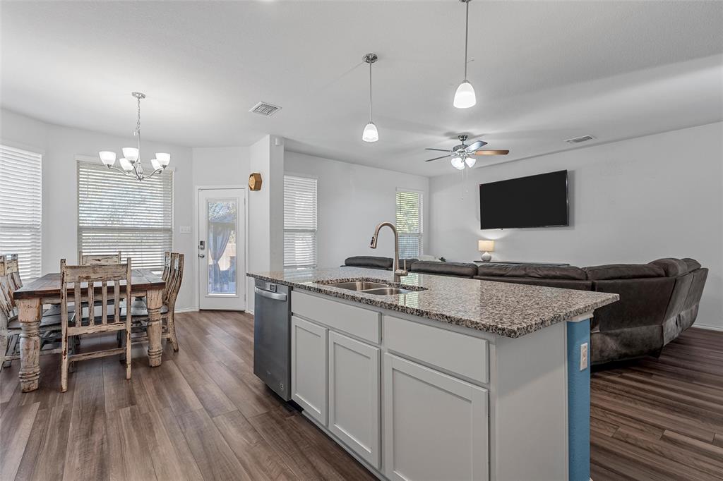 6201 Elephant Butte Drive Waco, TX 76708 - Photo 11 of 40 a kitchen with a center island appliances and wooden floor