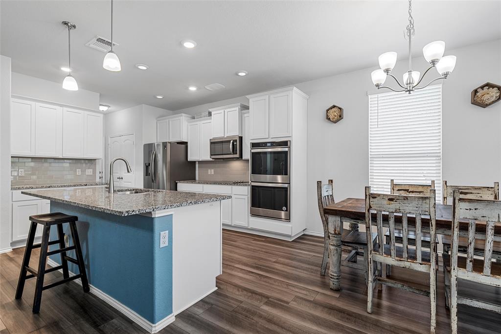 6201 Elephant Butte Drive Waco, TX 76708 - Photo 14 of 40 a kitchen with stainless steel appliances granite countertop a sink counter space and chairs in it