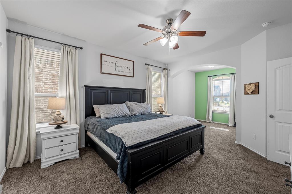 6201 Elephant Butte Drive Waco, TX 76708 - Photo 16 of 40 a bedroom with a bed and a chandelier