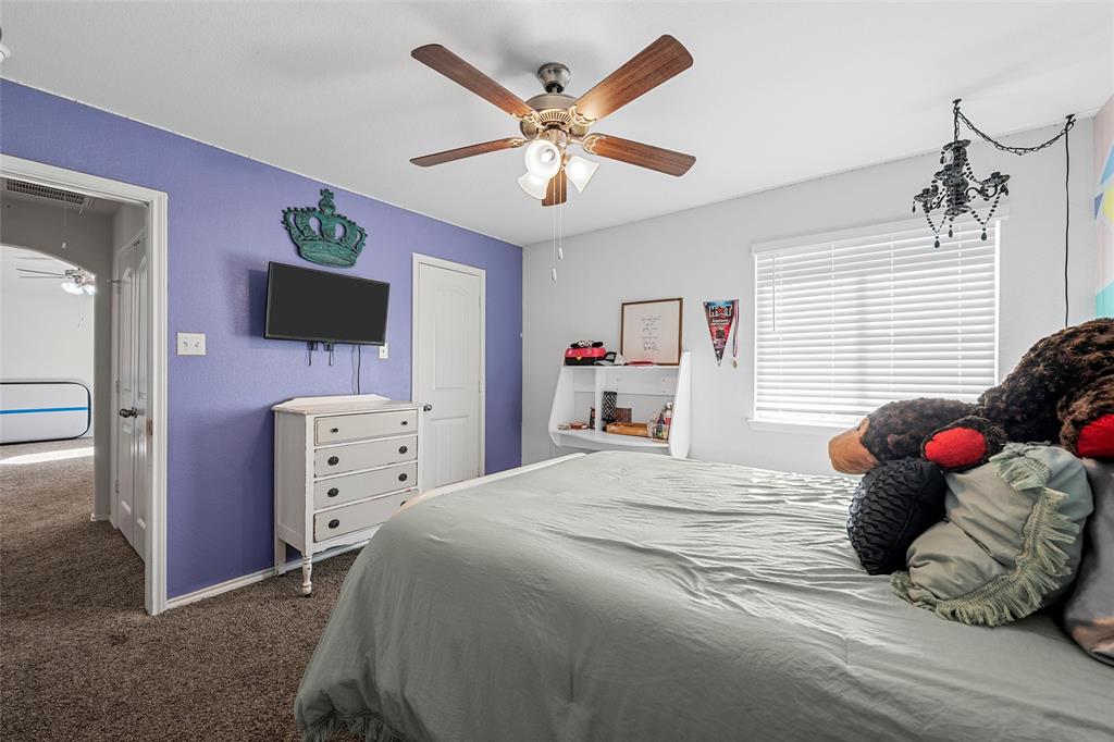 6201 Elephant Butte Drive Waco, TX 76708 - Photo 23 of 40 a bedroom with a bed and a flat screen tv