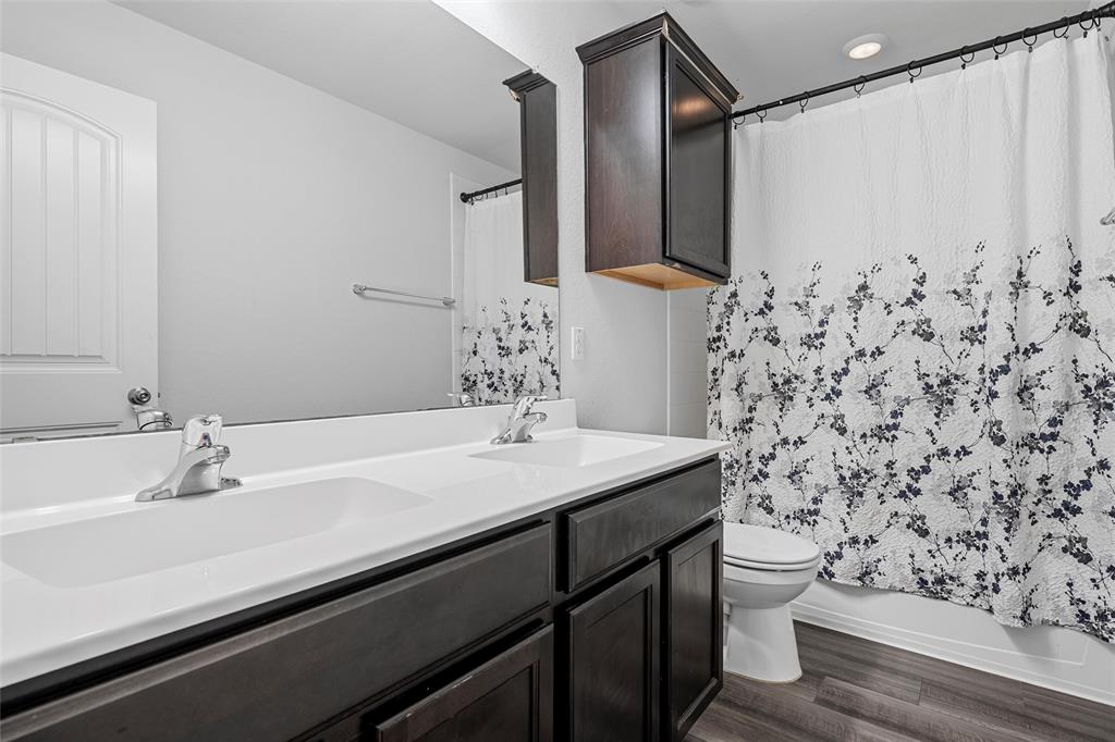 6201 Elephant Butte Drive Waco, TX 76708 - Photo 24 of 40 a bathroom with a sink toilet and shower