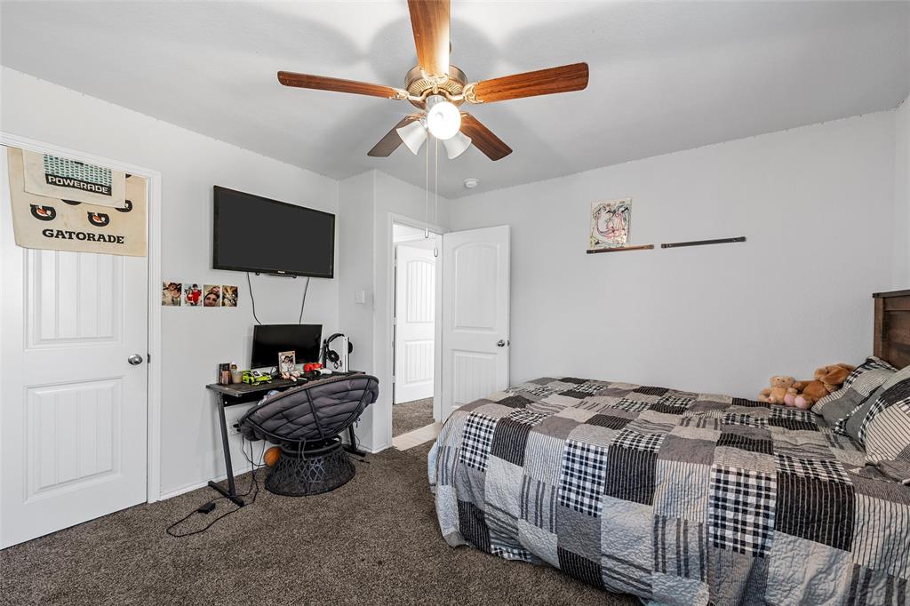 6201 Elephant Butte Drive Waco, TX 76708 - Photo 26 of 40 a bedroom with a bed and a flat screen tv