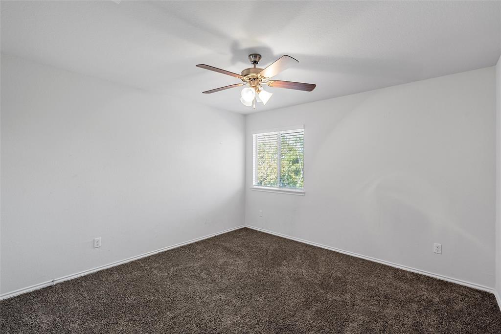 6201 Elephant Butte Drive Waco, TX 76708 - Photo 27 of 40 an empty room with a window and a fan