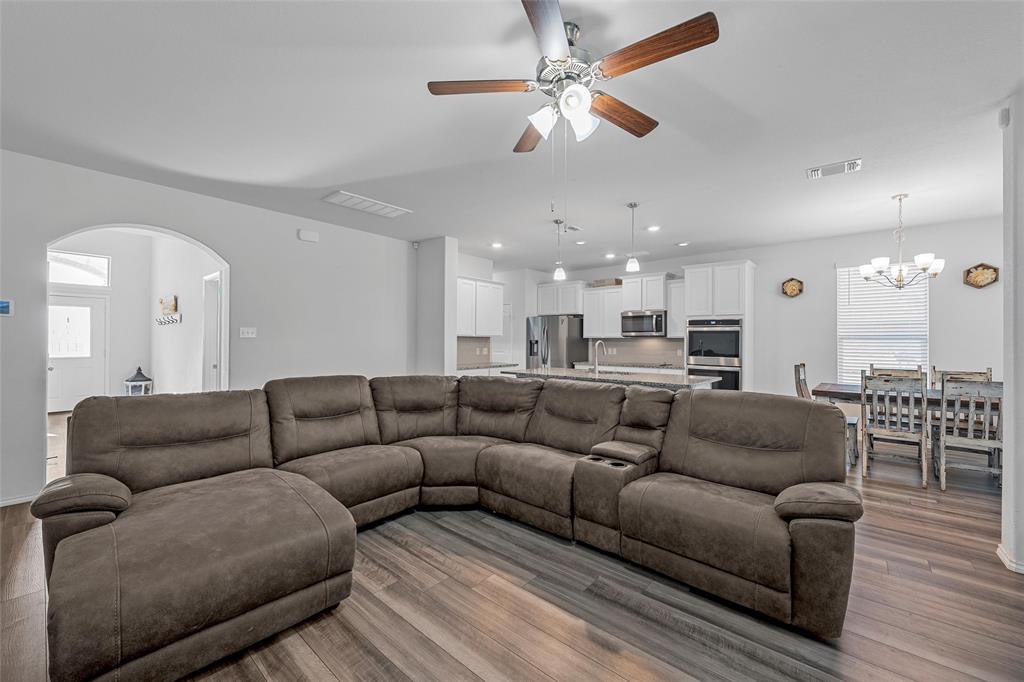 6201 Elephant Butte Drive Waco, TX 76708 - Photo 5 of 40 a living room with furniture and a chandelier