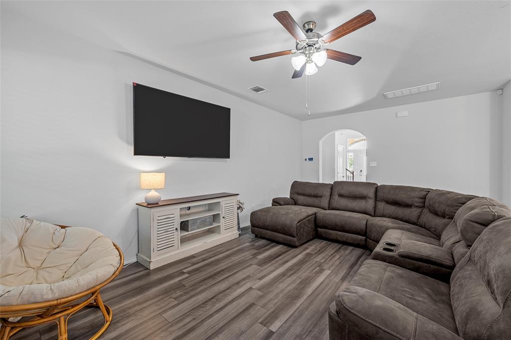 6201 Elephant Butte Drive Waco, TX 76708 - Photo 6 of 40 a living room with furniture and a flat screen tv