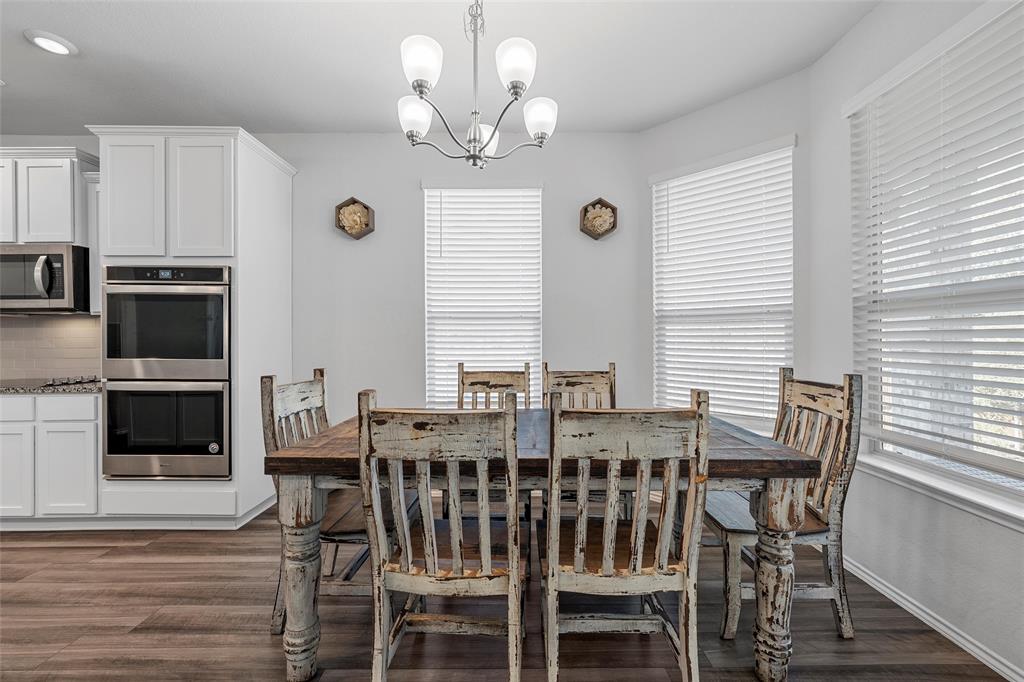 6201 Elephant Butte Drive Waco, TX 76708 - Photo 7 of 40 a view of a dining room with furniture window and wooden floor