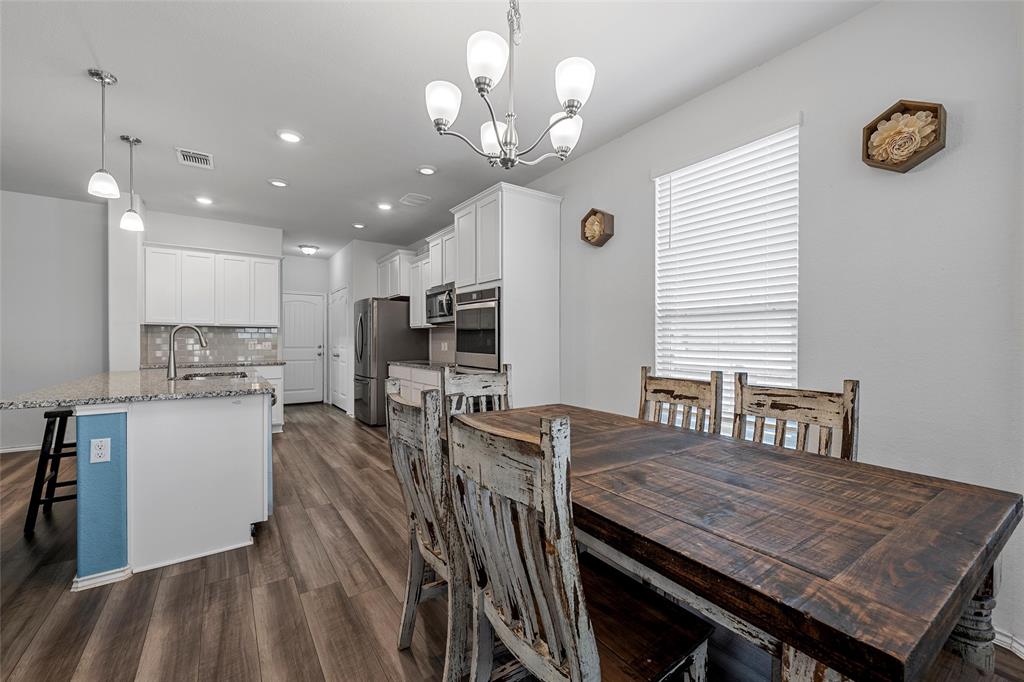 6201 Elephant Butte Drive Waco, TX 76708 - Photo 8 of 40 a view of a dining room with furniture and a chandelier
