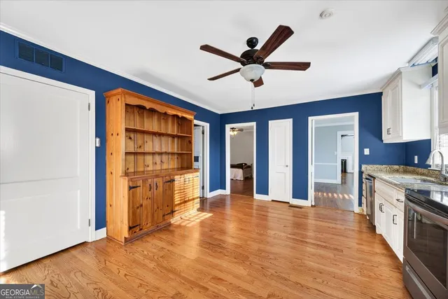 a view of a kitchen with a sink and a window