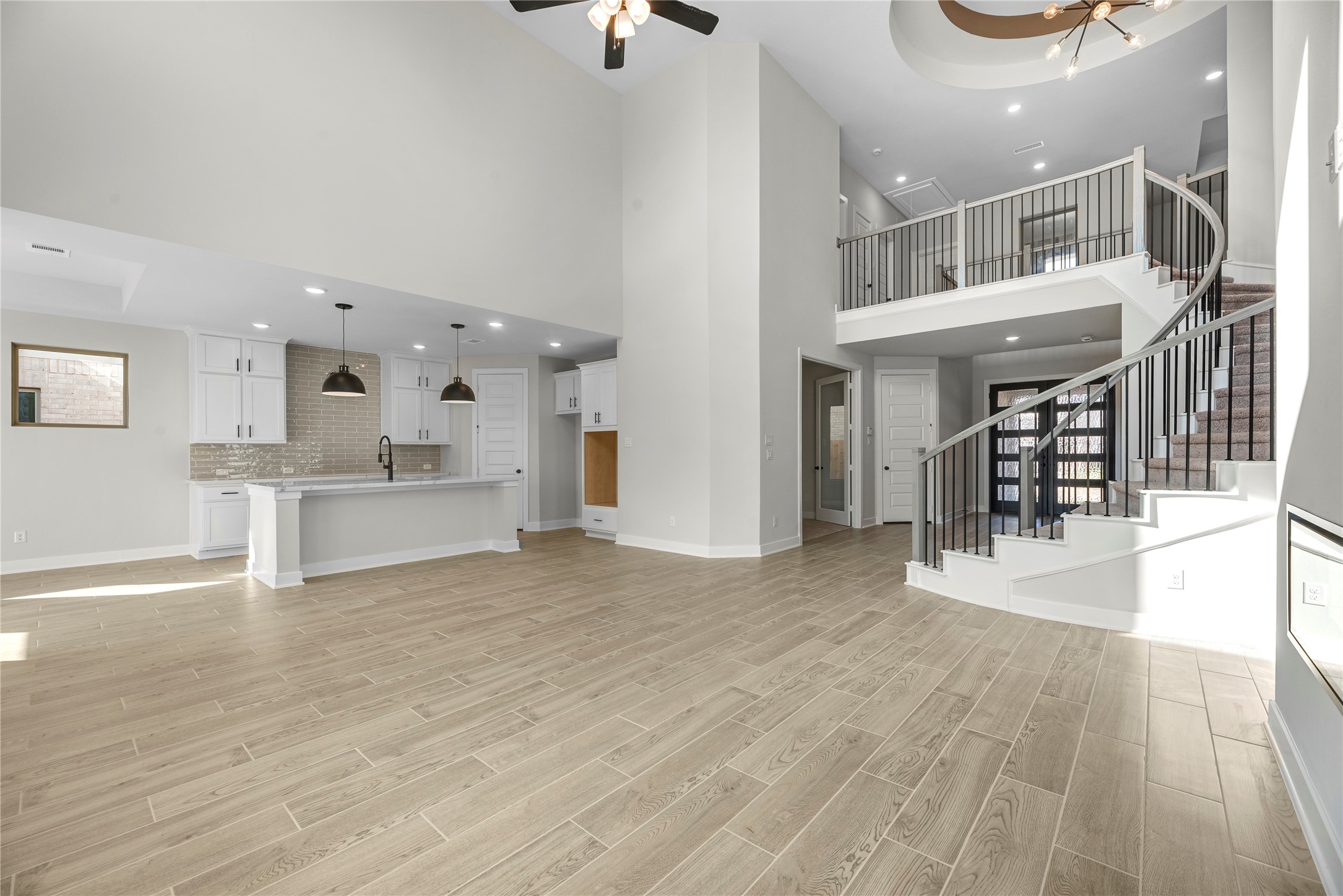 30927 Spring Lily Way Brookshire, TX 77423 - Photo 3 of 28 a view of a living room and kitchen with furniture and wooden floor