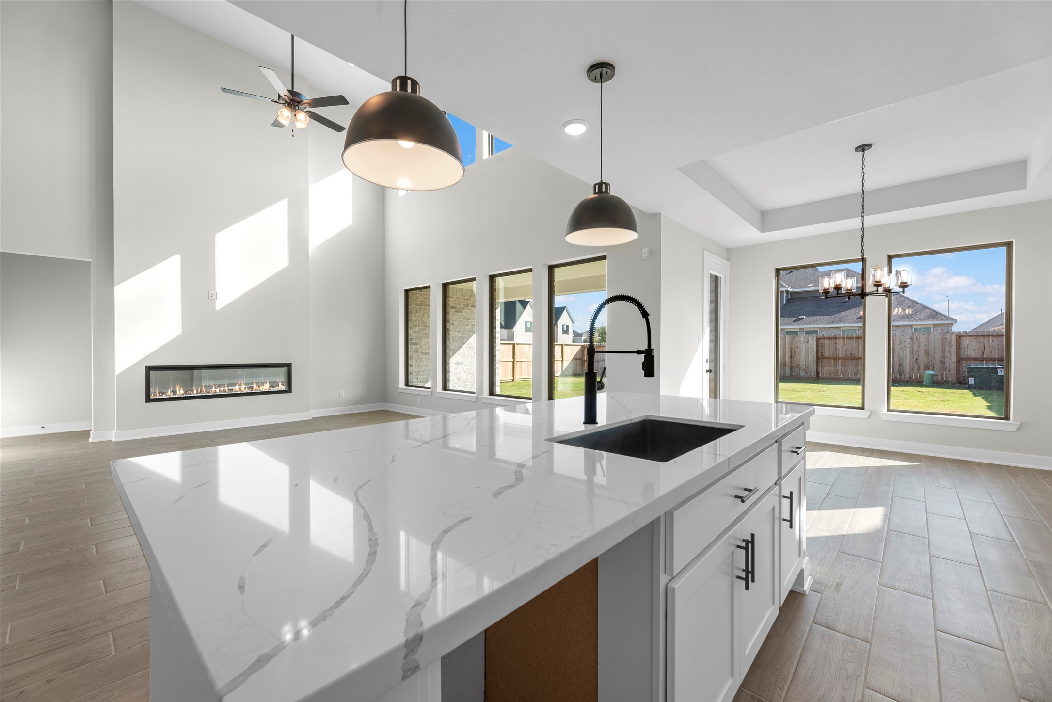 30927 Spring Lily Way Brookshire, TX 77423 - Photo 7 of 28 a open kitchen with stainless steel appliances granite countertop a stove and a sink with large windows