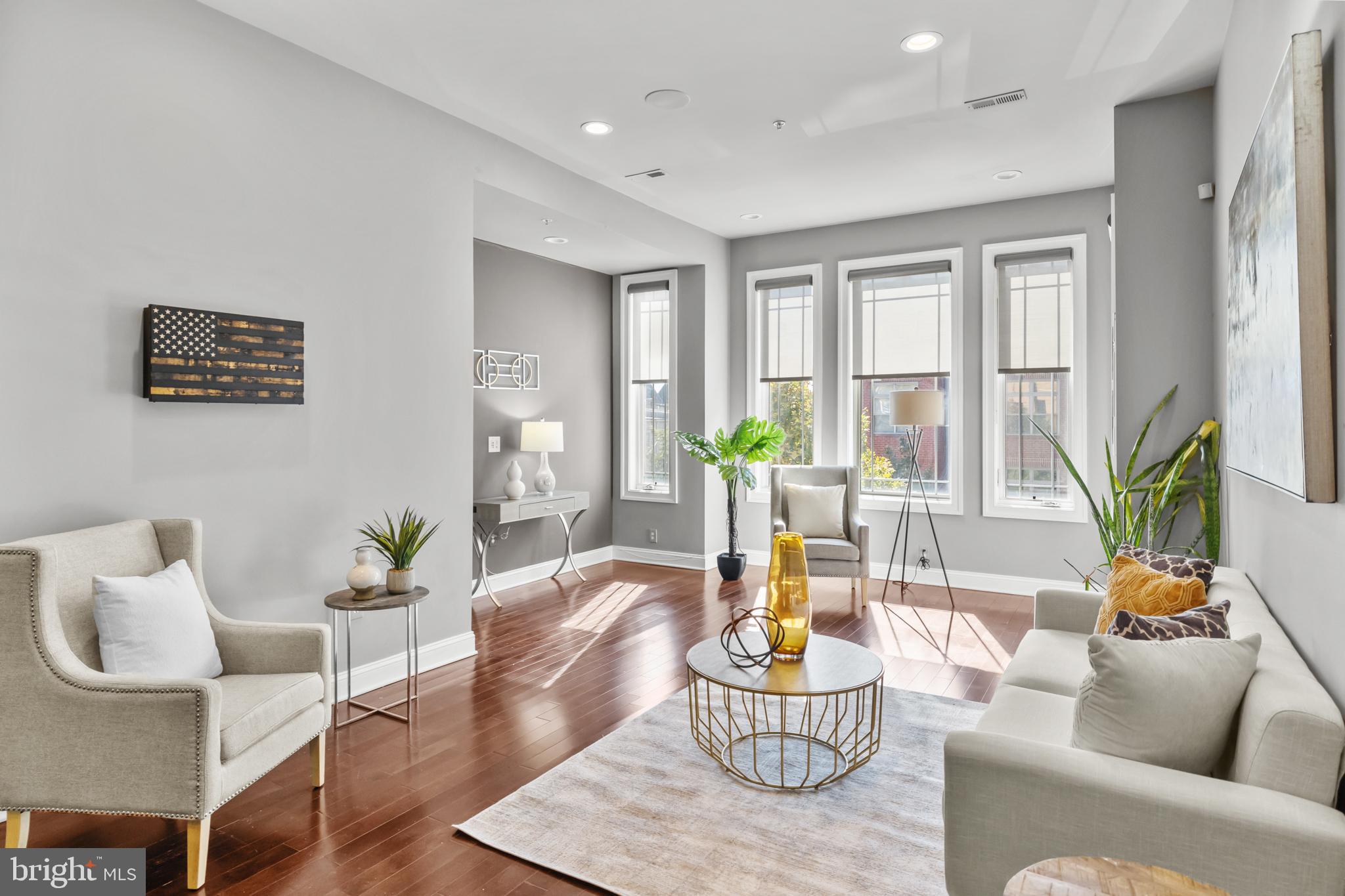 151 V Street Northwest, Unit 4 Washington, DC 20001 - Photo 3 of 49 a living room with patio furniture and a potted plant