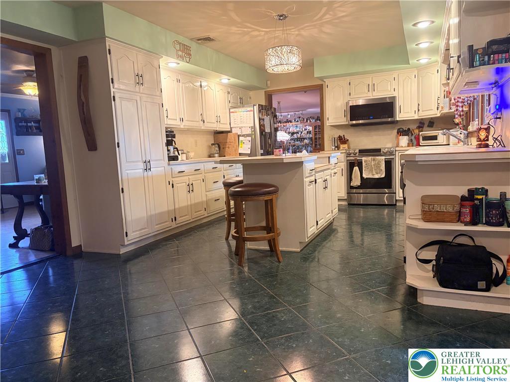 100 Hazelwood Road Lehighton, PA 18235 - Photo 12 of 31 a kitchen with a sink cabinets and wooden floor