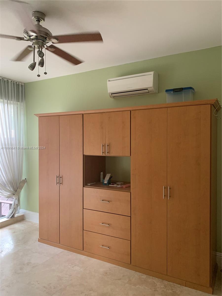 310 191st Terrace Sunny Isles Beach, FL 33160 - Photo 10 of 36 a view of a walk in closet