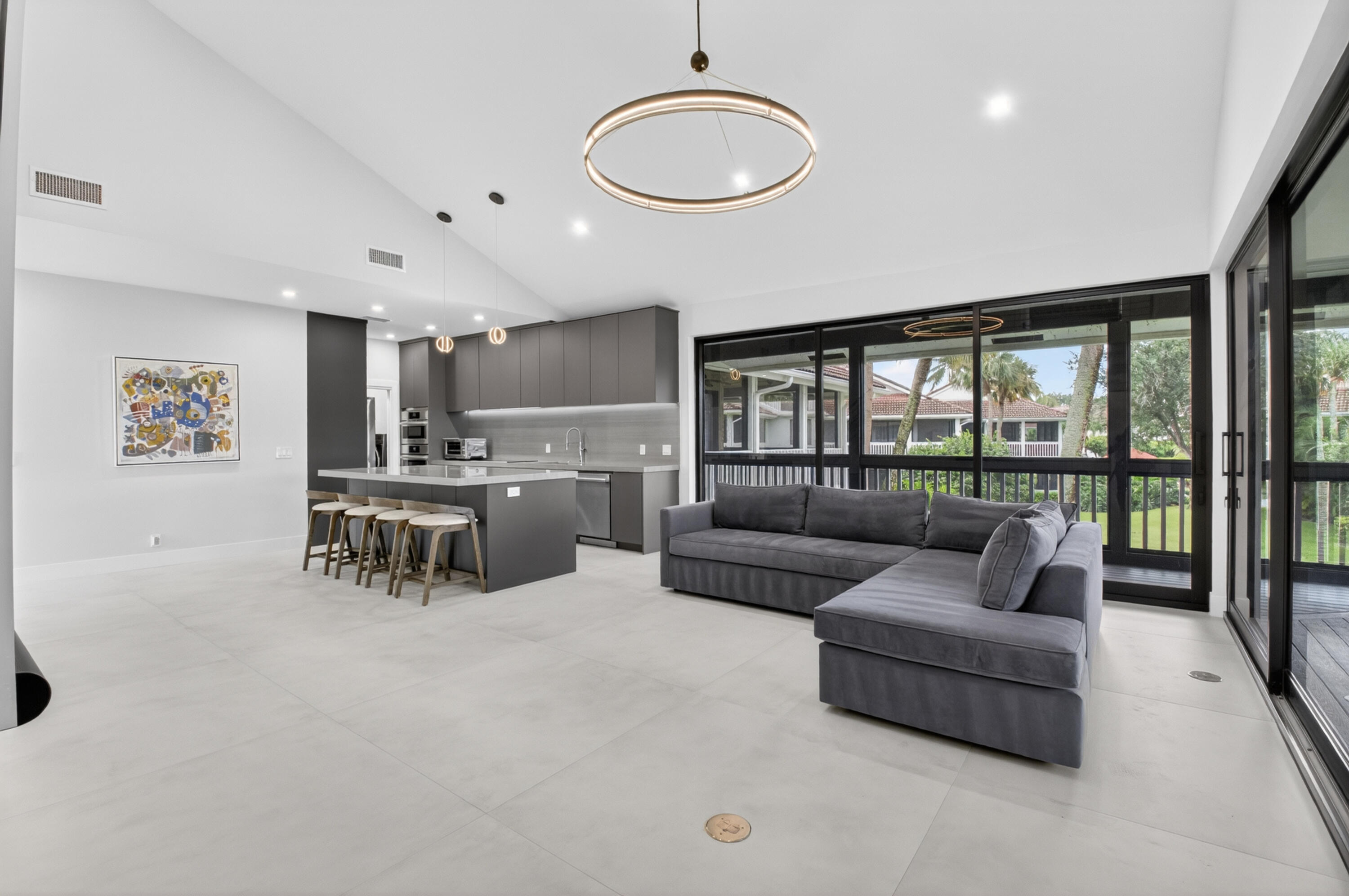 19221 Sabal Lake Drive, Unit 5124 Boca Raton, FL 33434 - Photo 16 of 98 a living room with furniture and a large window
