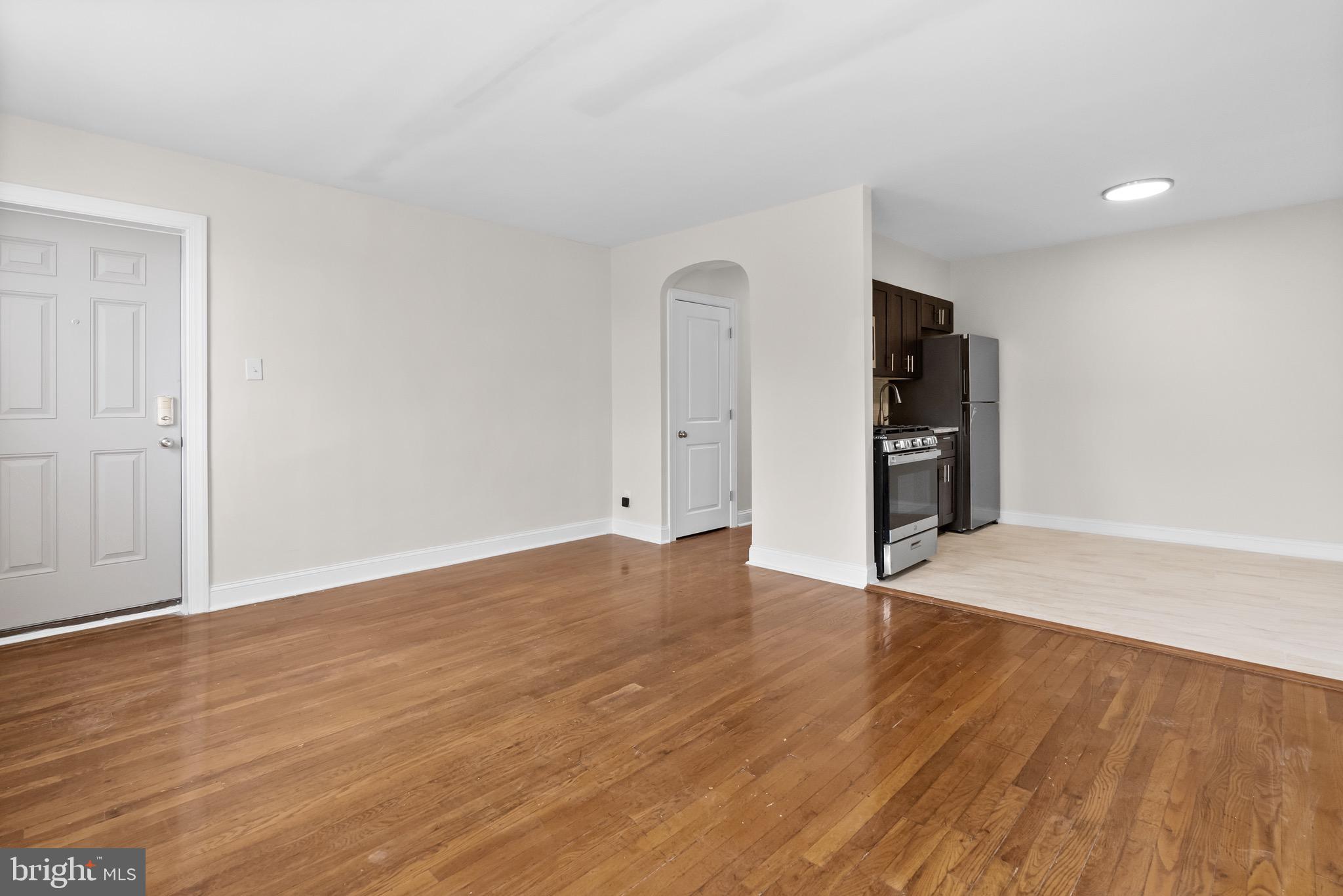 5160 D Street, Unit 2 Philadelphia, PA 19120 - Photo 3 of 23 a view of an empty room with wooden floor and closet