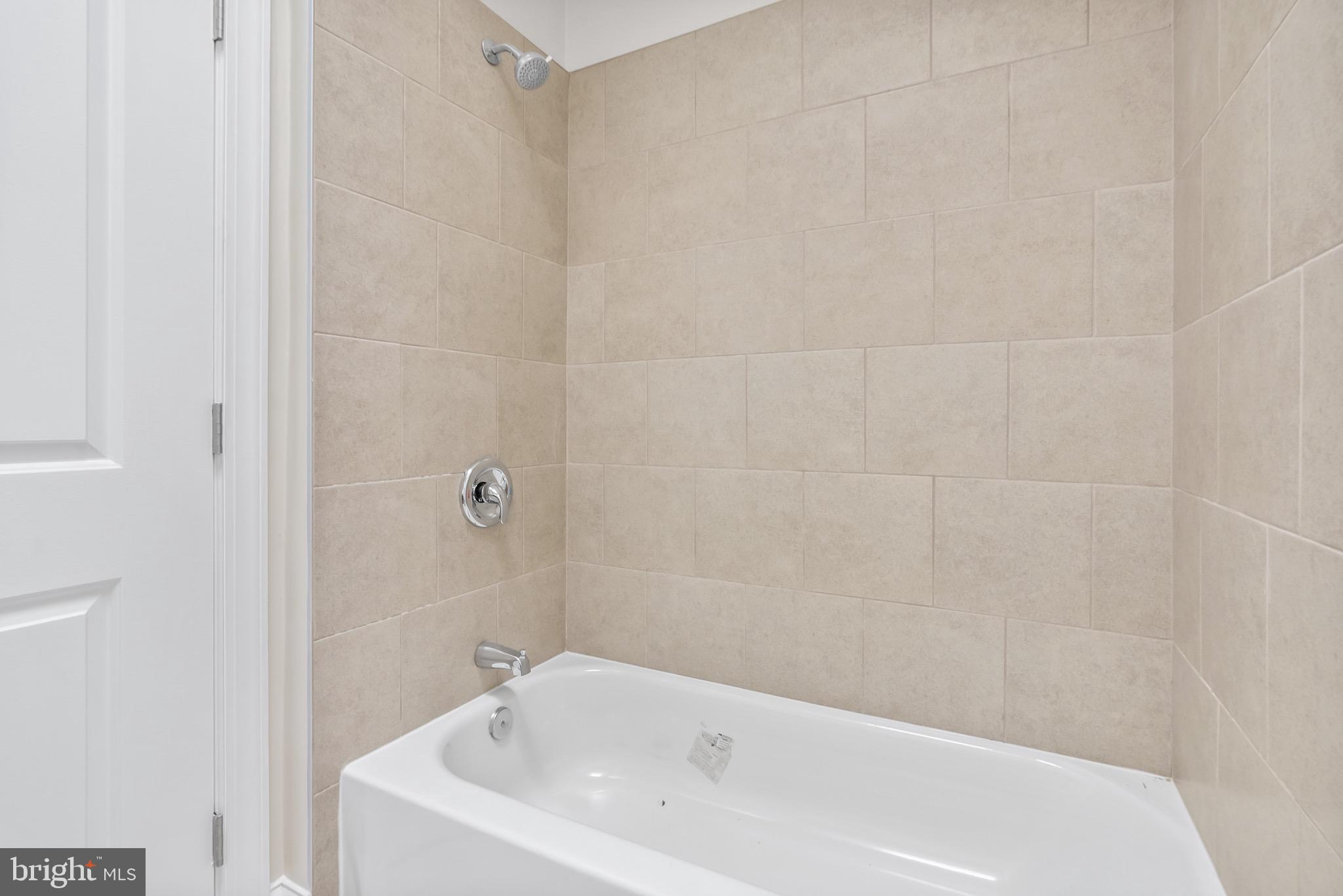 5160 D Street, Unit 2 Philadelphia, PA 19120 - Photo 10 of 23 a bathroom with a white bath tub