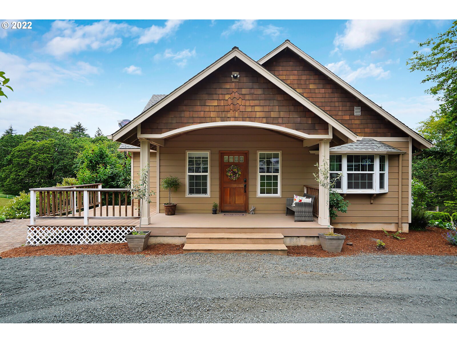 14997 Orchard Knob Road Dallas, OR 97338 - Photo 1 of 32 a front view of a house with a porch
