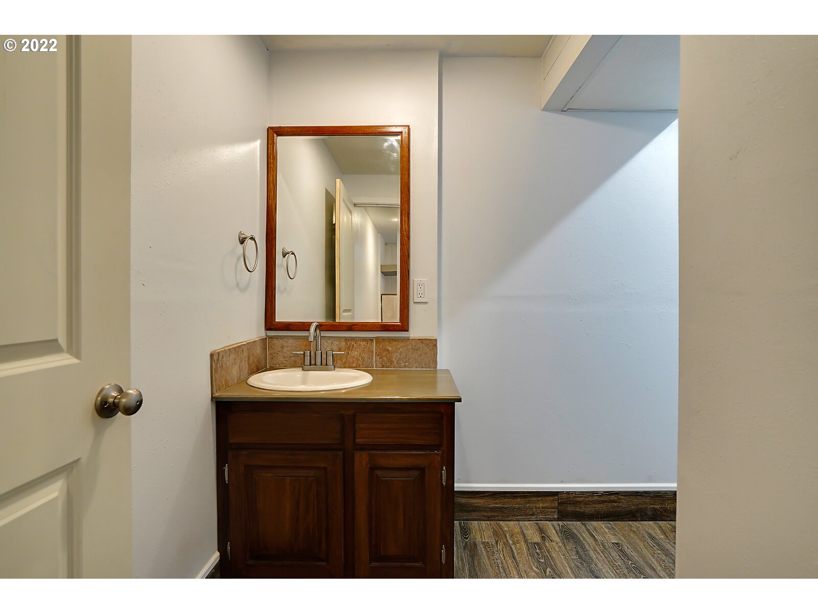 14997 Orchard Knob Road Dallas, OR 97338 - Photo 18 of 32 a bathroom with a sink and a mirror